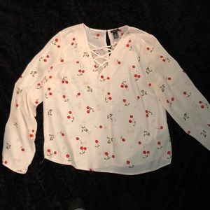 A beautiful long sleeve cherry and flower blouse